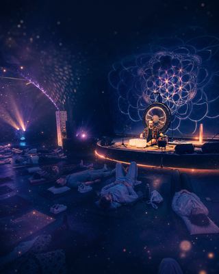 Participants engage in a sound healing session led by a musician, creating a serene atmosphere at the HOLOLIFE Summit.