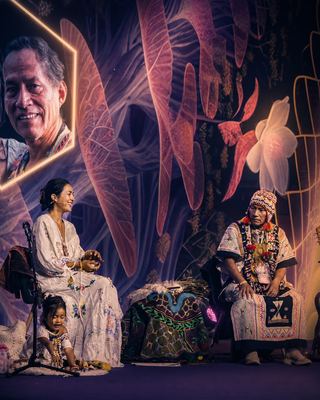 A vibrant on-stage moment showcasing cultural expressions at the HOLOLIFE Summit 2026.