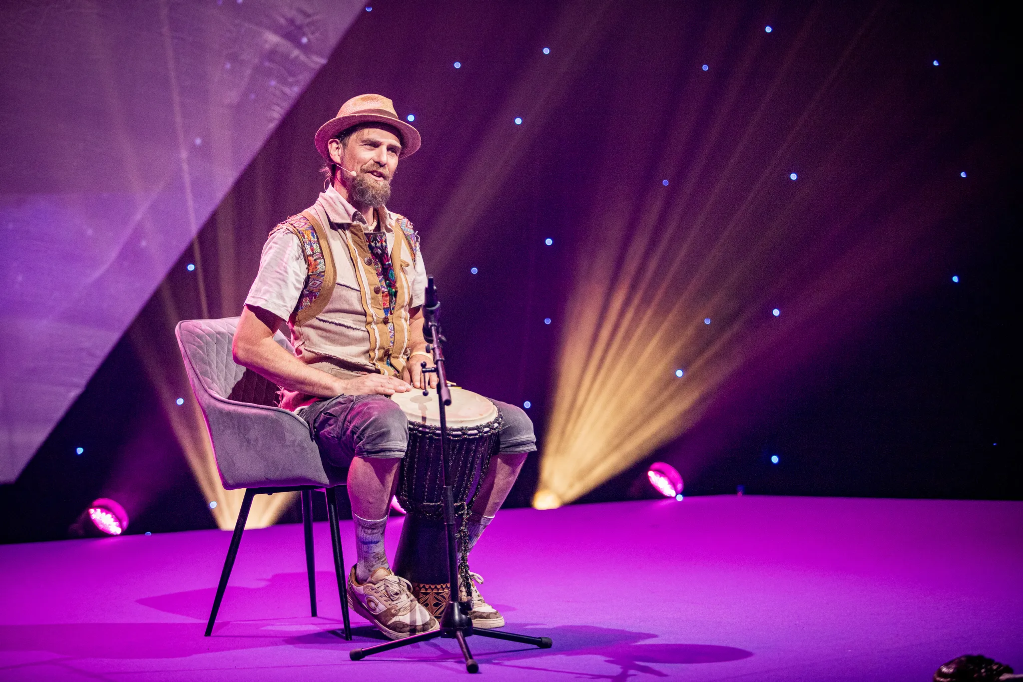 A djembe performer on stage at HOLOLIFE Summit 2025 Europe in Tallinn