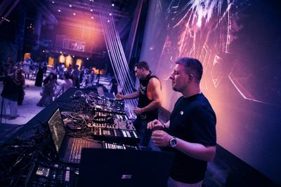 DJs performing live with an energetic crowd dancing at the Biohacker Summit 2020.